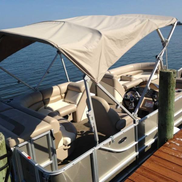 a pontoon boat on a body of water