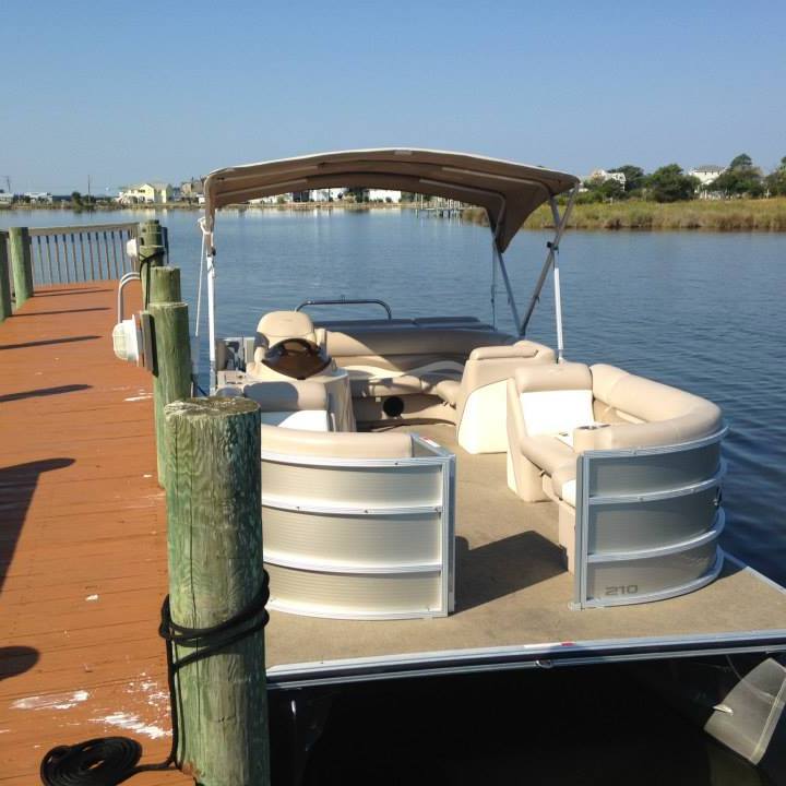 a pontoon boat on a body of water