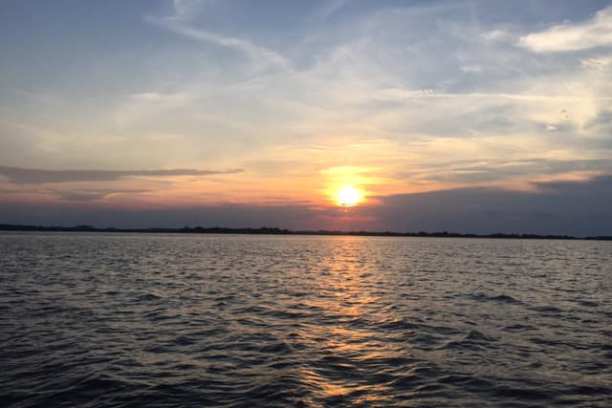 a sunset over a body of water